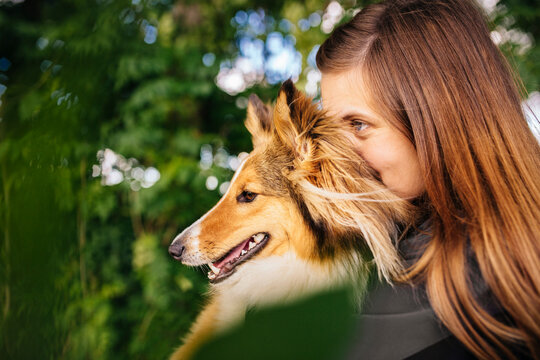 Portrait of woman holding dog