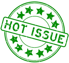 Grunge green hot issue word with star icon round rubber seal stamp on white background
