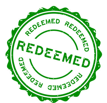 Grunge green redeemed word round rubber seal stamp on white background