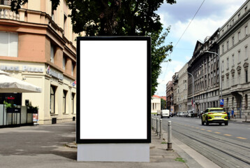 blank digital ad panel. billboard display. empty white lightbox sign at busstop. glass structure....