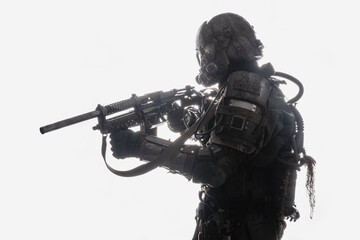 Shot of military man with rifle and gas mask against white background with backlit.