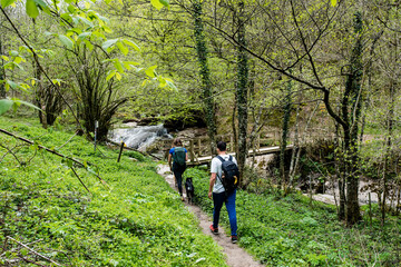 Young couple in sportswear doing a breack during a hike near Holzarté in the French Basque Country