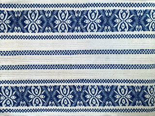 Blue and white kitchen textile texture background. Closeup of natural linen or cotton vintage dish towel  or tablecloth fabric. Eastern European pattern print or embroidery ornament on picnic cloth.