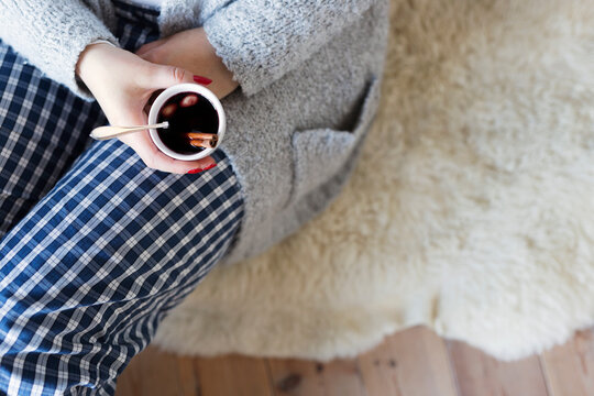 Woman holding cup with mulled wine