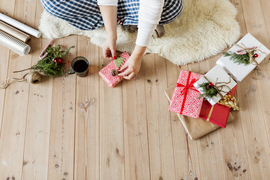 Woman wrapping Christmas gift