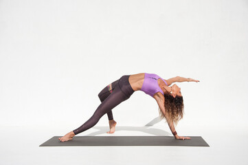 Woman practicing yoga. 