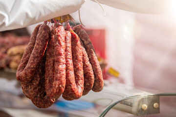 Fresh pork sausage rings lie on the counter of the meat market. Smoked meat products handmade....