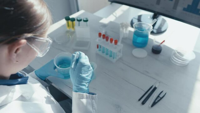 Video fragment presents the work of scientists in a chemical laboratory, where research is conducted to identify new chemical compounds with medical potential in field of beauty, skin and body care