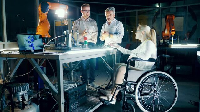 Engineer with disability works with colleges at modern science lab