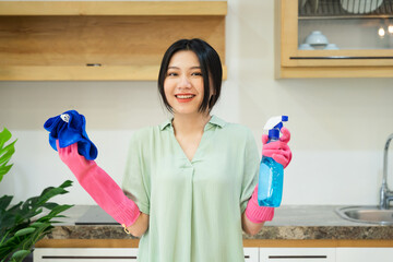 portrait of asian girl cleaning the house