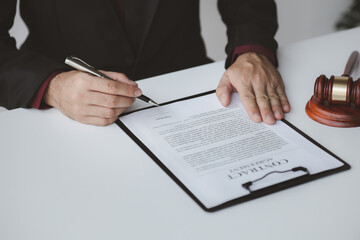 Lawyers, lawyers in the office and legal documents for use in arguing and planning cases for clients to win the case. Lawyer concept upholding the law and assisting clients in legal cases.