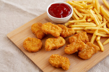 Chicken Nuggets and French Fries with Ketchup Ready to Eat. Close-up