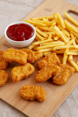 Chicken Nuggets and French Fries with Ketchup Ready to Eat. Close-up