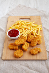 Chicken Nuggets and French Fries with Ketchup Ready to Eat. Close-up