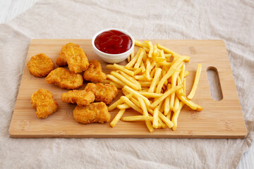 Chicken Nuggets and French Fries with Ketchup Ready to Eat. Close-up.