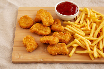 Chicken Nuggets and French Fries with Ketchup Ready to Eat. Close-up.