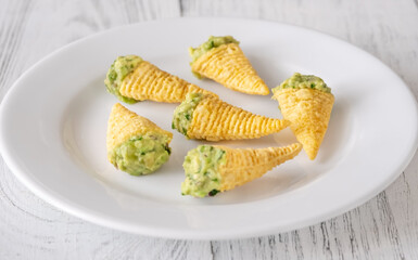 Tortilla chips cones with guacamole