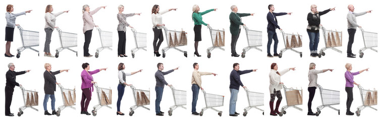 a group of people with a shopping cart point their fingers in front of them