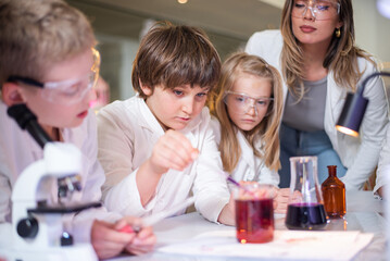 Elementary school children doing experiments in the laboratory