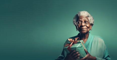 Fototapeta premium Attractive mature aged woman holding presents gift box feels happy studio isolated on purple background. Life events celebration congratulation love care concept. Generative with Ai tools.