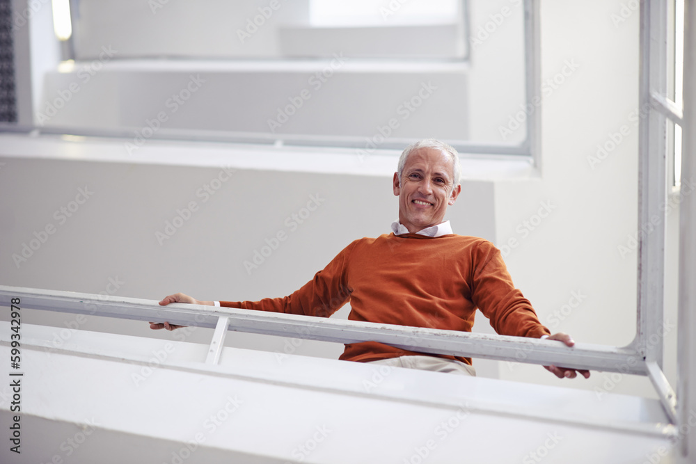 Wall mural im on my way to the top, care to join. low angle portrait of a businessman looking down a flight of 