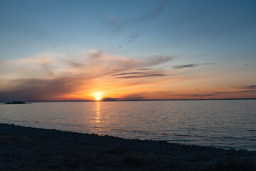 Fototapeta premium sunset over the sea. the sun sets in the water