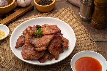 Fried sun dried pork in white plate.(Moo dad deaw).Asian food style,food preservation