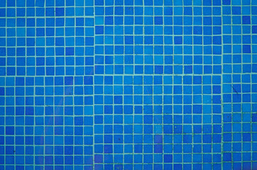 blue background of a swimming pool in summer with copy space. Summertime Vacation