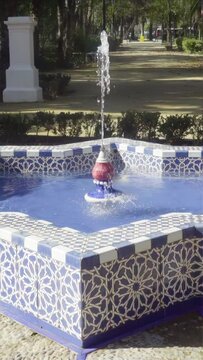 Slow motion video of Andalusian tile fountain in Maria Luisa Park, Seville
