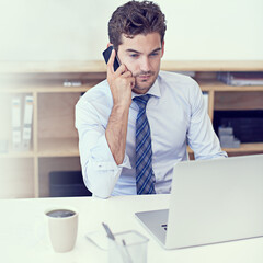 Talking to a client. a handsome young businessman working in his office.