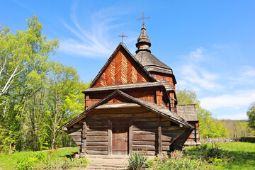 Fototapeta na wymiar Church of St. Nicholas from the village of Zelenoe (Podolia) in skansen Pirogovo in spring time in Kyiv, Ukraine