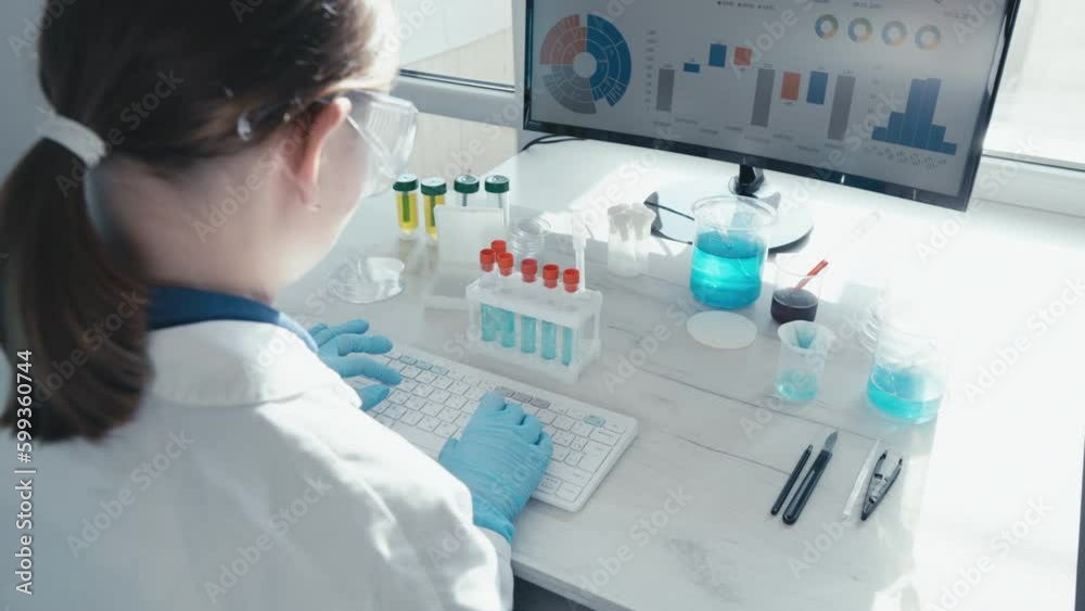 Poster The scientist analyzes data in a large medical database using computer algorithms and statistical methods. A doctor in a chemical laboratory works on a keyboard behind a computer screen.