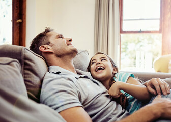 Dads the one shell always look up to. a father and his little daughter bonding together at home.