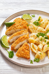 breaded chicken fillet with alfredo pasta shells