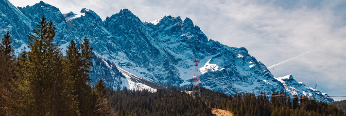 Winter view with the tallest cable car support in the world at Lake Eibsee, Mount Zugspitze,...