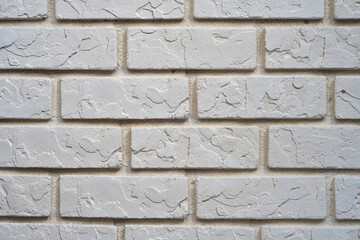 a wall in a beige brick house