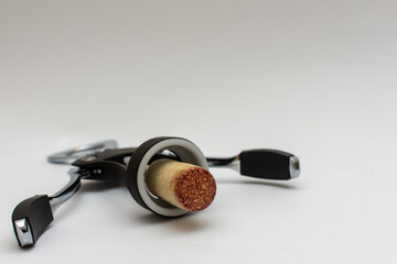 Black corkscrew with wine cork