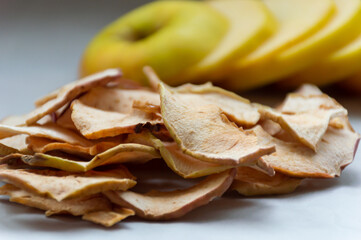 Dried apples on the background of fresh apple slices - Powered by Adobe