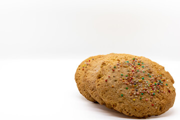 Stack of Large Cookies with colored chips, Venezuelan cookies, isolated on white background, selective focus