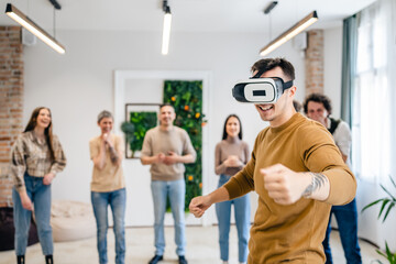 One man in front of group of friends enjoy virtual reality VR headset