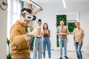 One man in front of group of friends enjoy virtual reality VR headset