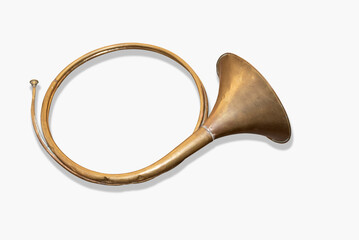 Golden antique cornu trumpet on white background, air musical instrument