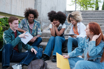 Group of friends studying and chatting together at the university campus. Concept: friendship, diversity, education