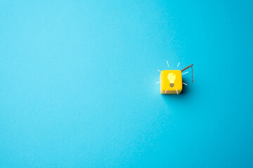 Light bulb on with chain switch. The new idea or inspiration being sparked. Choice made. Ingenuity and creativity. Eureka moment