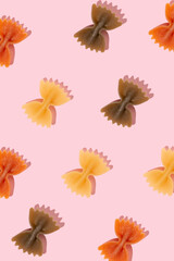 Dough in the form of bows on an orange background, food theme, minimalism, pattern
