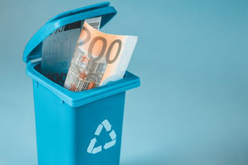 abandonment of the 200 euro banknote, withdrawal of money from circulation,  business and finance concept, Miniature garbage can with two hundred Euro banknote, European Union stop printing money,