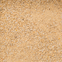 Biofuel, Biofuels, Eco Fuels. Cat's Litter Box. Filling the Cat Litter Tray. Clumping cat litter. Brown- Orange Texture. Macro. Products for Pets. Small Deep Brown Pebbles