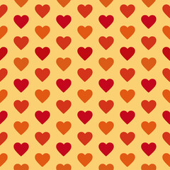 Geometric seamless pattern with orange and red hearts on the yellow background. Hearts pattern. Valentine's Day. In hippie style. 70s 80s