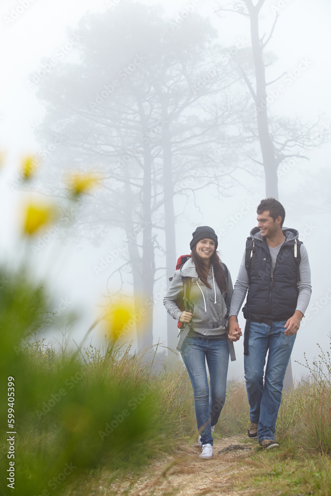 Canvas Prints Hiking hand in hand. Full length shot of a young couple hiking along a nature trail.