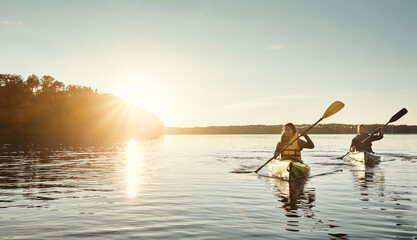 Make memories on the water. a young couple kayaking on a lake outdoors. - obrazy, fototapety, plakaty